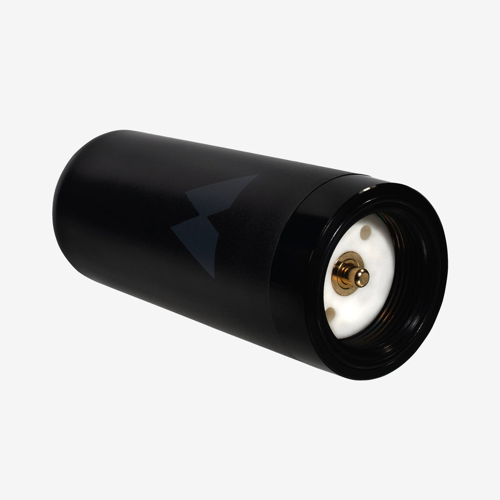 Black antenna with a white interior and gold electrical connection component.
